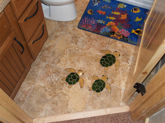 Turtles installed in a bathroom floor